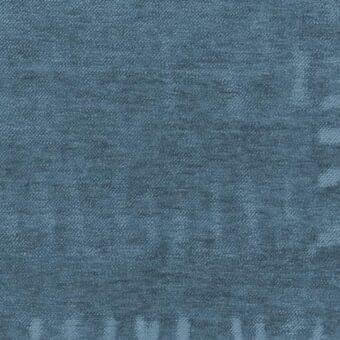 Teal fabric sample with heathered texture, dense weave, and faint geometric leaf patterns; displays “ditre italia” manufacturer text.