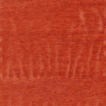 Terracotta fabric texture with a tight weave and subtle vertical striations, displaying a matte finish and printed label detail.