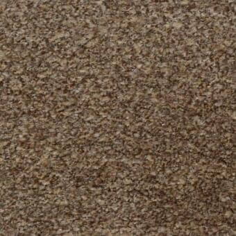 Ditre Italia fabric sample, warm brown, granular texture with beige and tan highlights, matte finish, irregular flake composition.