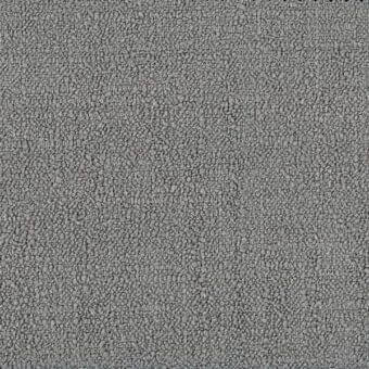 Ditre Italia lounge fabric texture, gray granular surface, irregular particle composition, uniform speckled appearance, neutral lighting.
