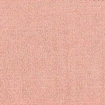 Boucle fabric texture in muted salmon pink, densely woven with looped yarn, matte finish, displaying “ditre italia” label detail.