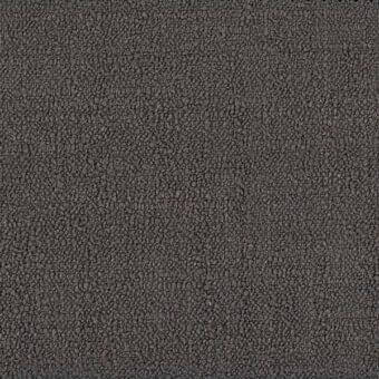 Fabric texture sample displaying dense gray granules, irregular particles, and a medium-dark tone; ditre italia lounge fabric detail.
