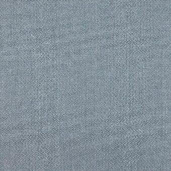 Woven fabric texture in blue-gray with subtle repeating pattern, matte finish, and sporadic lighter gray and green flecks; ditre italia Tallin 020.