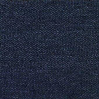 Navy blue woven fabric sample displaying a dense, granular texture with raised bumps; Ditre Italia tape 318 textile detail.