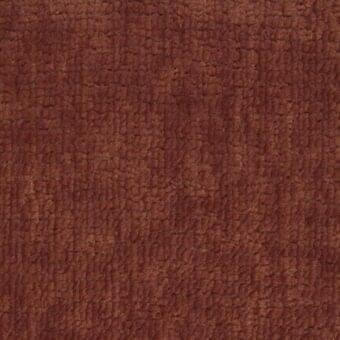 Reddish-brown fabric texture with dense looping, mottled tonal variations, and a raised, uneven surface; “texas 016” ditre italia label visible.