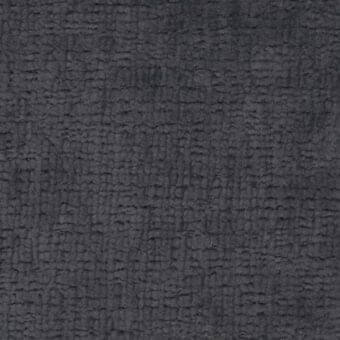 Dark gray fabric texture with raised bumps, woven matte finish; ditre italia “texas 018” sample tag visible in corner.