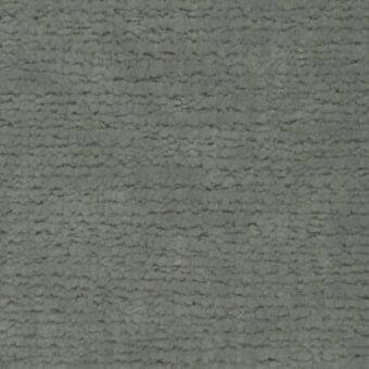 Ditre Italia fabric texture sample, muted gray-green, dense irregular weave with raised bumps and a matte finish, labeled “texas 022”.