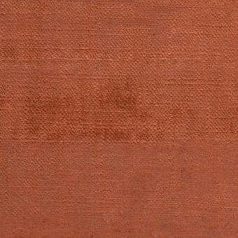Terracotta fabric sample with a woven, mottled texture; horizontal color band and matte finish, labeled “ditre italia Trend 052”.