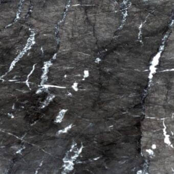 Dark gray marble texture, “ma08 grigio carnico” by Ditre Italia, features irregular white veins and a polished, mottled surface.
