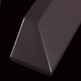 Metallic finish sample “me03 testa di moro” by Ditre Italia, reddish-brown hue, smooth brushed texture, angled rectangular cut.