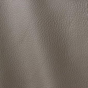 Gray leather texture sample, “Polar 210” by ditre italia, displays a fine grain and subtle sheen with consistent tonal variations.