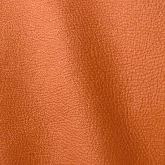 Leather texture sample, Polar 246 by ditre italia, warm orange with fine grain and subtle tonal variations, displaying a vertical crease.