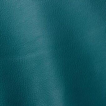 Teal full-grain leather texture sample, exhibiting a granular pattern and matte finish; Ditre Italia Polar 270 leather grade.