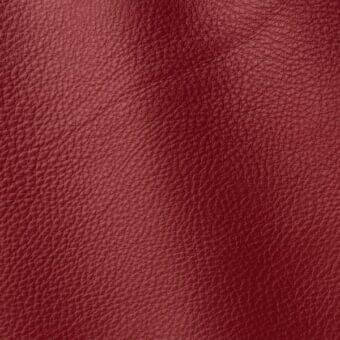 Red leather texture sample “Polar 288” by ditre italia, exhibiting a matte finish and pebbled grain with natural creases.