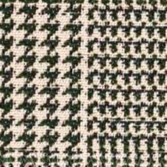 Houndstooth fabric, olive green and beige, dense weave with visible threads and angular pattern; textile sample labeled “egoitaliano basquiat”.