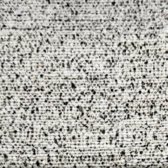 Light gray ribbed fabric texture with speckled pattern, displaying a dense woven construction and slight surface roughness; egoitaliano grease 004.