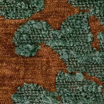 Textile sample, green and rust woven fabric, organic looped fiber pattern with “egoitaliano kosmo blucle 1920” designation visible.