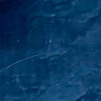 Blue fabric laminate texture with rippling effect and white highlights, displaying a smooth, uneven surface with subtle linear markings.