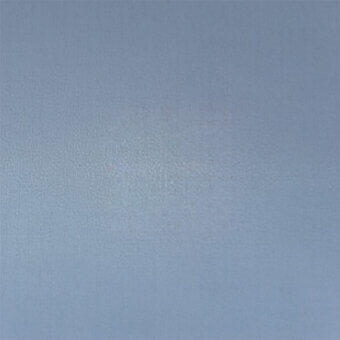 Pale blue-gray plaster wall texture with gradient shading, granular surface, and uneven finish; neutral backdrop composition.