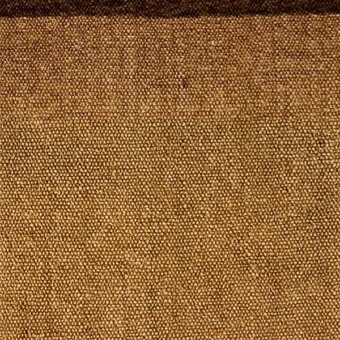 Microfiber fabric texture in golden-brown, displaying a dense, matte weave with a granular surface and subtle speckled pattern; labeled “egoitaliano”.