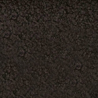 Dark brown microfibra fabric texture, “naixe” by egoitaliano, features a dense, irregular, cratered surface with raised nodules.