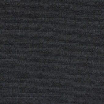 Dark gray woven fabric sample displaying a dense, grid-like texture; label reads "erba fabrics torino 81".