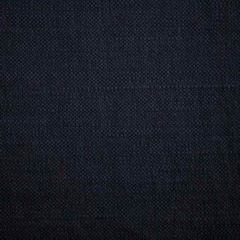 Charcoal gray fabric sample with a dense, nubbed weave and matte finish; textured material likely wool blend for upholstery, labeled “siena 0651”.