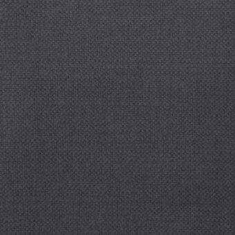 Dark gray woven fabric texture, granular surface with circular elements, matte finish, studio sample from erba collection Siena 109971.