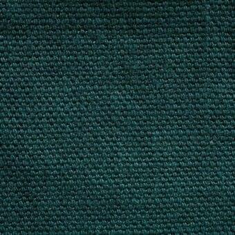 Teal stone-washed linen fabric texture with a dense, nubby weave and matte finish; tag reads "erba fabrics fabric 509".