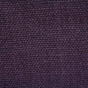 Stone-washed linen texture in dark plum displays dense, looped pile with uniform nubby pattern and subtle color variations throughout the fabric.