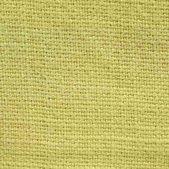 Stone washed linen texture, giallo color, dense weave with horizontal and vertical threads, matte finish, pale yellow tone, organic appearance.