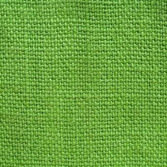 Stone-washed linen fabric texture, verde chiaro color, dense weave with small knots, matte finish, natural textile appearance.