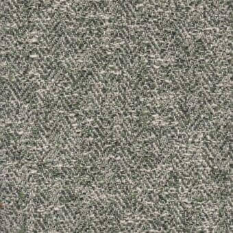 Fabric texture sample, granular gray and olive with beige accents, displaying a mottled, uneven surface and muted earthy tones.