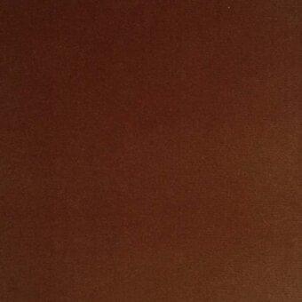 Brown velvet fabric swatch with a matte finish and subtle grain, displaying “erba Lario Velluto” text detail.