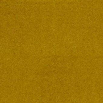 Mustard yellow velvet fabric sample displaying a matte, granular texture and consistent nap throughout the woven material from the erba collection.