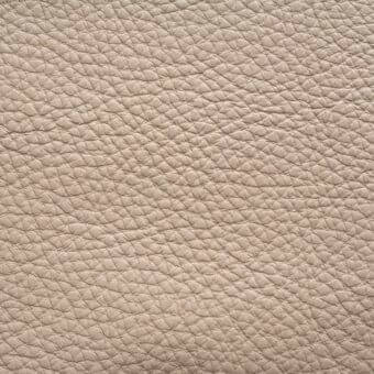 Ascot leather texture, light beige clay color, pebble-grain pattern with rounded bumps and subtle creases, matte finish.