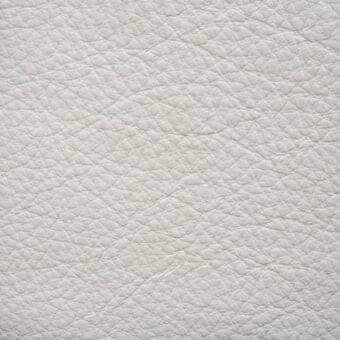 White lamb leather Ascot sample, pebble-grain texture, matte finish, neutral tone, diffused lighting, erba leather collection.