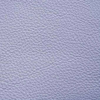 Lavender leather texture displaying a granular grain pattern, smooth finish, and consistent quality against a white backdrop, with supplier labeling.