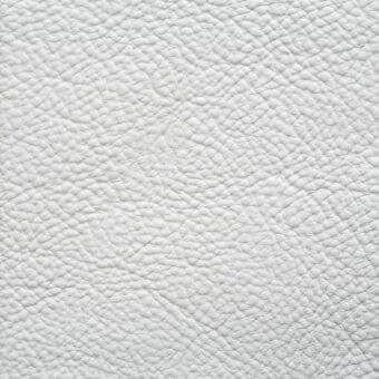 White pebble-grain leather texture with matte finish, displaying “erba > leathers > ascot > zinc” label on a white background.