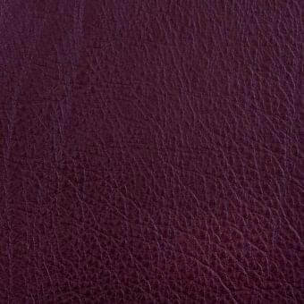 Bordeaux leather texture displaying a crystalline grain, matte finish, and subtle tonal variations for depth and a natural, durable appearance.