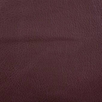Castagna leather texture with a matte finish, displaying a reddish-brown color and intricate grain pattern with a horizontal seam.