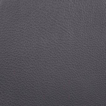 Dark gray crystal leather texture sample, “grigio” shade, displaying a dense, irregular grain pattern and matte, slightly pebbled finish.