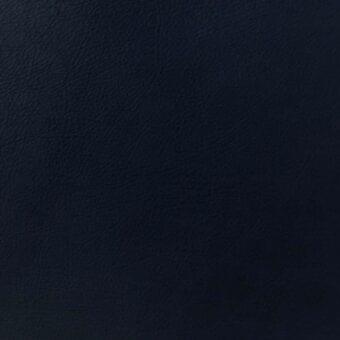 Dark blue leather texture displaying a mottled grain with fine creases, presenting a matte finish and uniform, slightly rough surface.