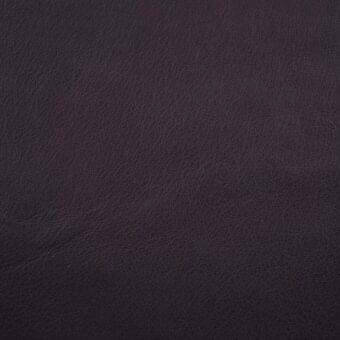 Dark gray Daino leather texture with a matte finish, displaying subtle distressing and a natural grain pattern against a neutral backdrop.
