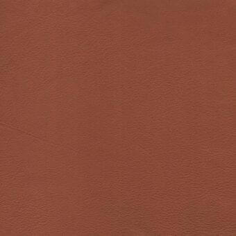 Full-grain leather sample, british tan color, subtly pebbled texture with natural grain and matte finish.