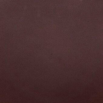 Daino mud leather texture, dark brown with reddish undertones, exhibiting a granular matte surface and natural grain pattern.