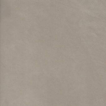 Light gray nubuck leather texture, “nabuk grigio chiaro” from the erba collection, displays a matte, granular surface with natural grain variations.