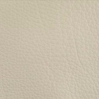 Beige leather texture, Piumone Sabbia sample with pebble-grain, matte finish, and subtle creases displaying a warm, sandy tone in diffused light.