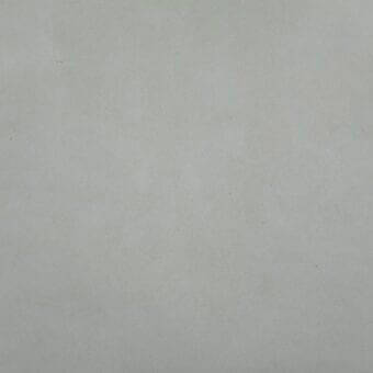 Stonewash beige leather swatch with matte finish, textured surface, and subtle tonal variations displayed against a neutral backdrop.