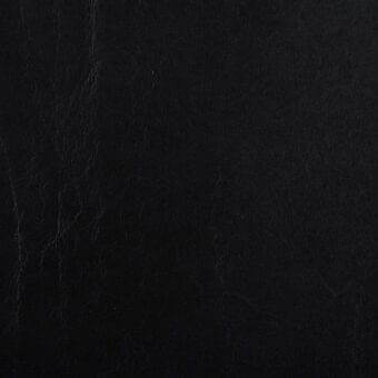 Stonewash black leather texture with a matte finish, displaying vertical grain and creases against a neutral backdrop.